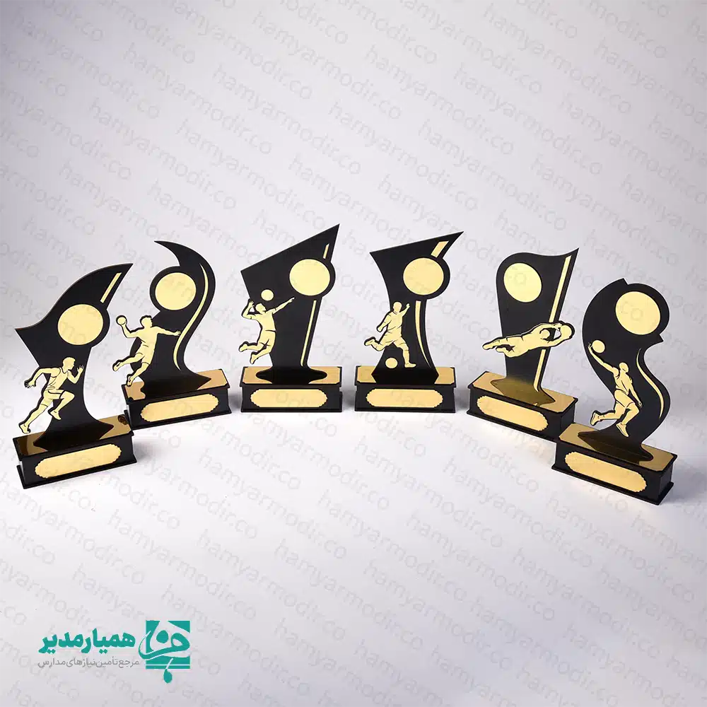 " تندیس ورزشی مدل قهرمان؛ نماد درخشش و پیروزی 🥇✨ تجلیل از تلاش‌های ورزشی دانش‌آموزان، یکی از موثرترین راه‌ها برای تقویت اعتمادبه‌نفس و ایجاد انگیزه در آن‌هاست. تندیس ورزشی چوبی مدل قهرمان، با طراحی پویا و نمادین، به‌خوبی حس حرکت و موفقیت را منتقل می‌کند. این تندیس‌ها به گونه‌ای طراحی شده‌اند که با قرارگیری در دکور اتاق یا بوفه افتخارات دانش‌آموز، همواره خاطره خوش پیروزی را برای او زنده نگه دارند. طراحی هوشمندانه و متریال باکیفیت 🎨 در ساخت این محصول از تکنولوژی برش لیزری دقیق استفاده شده است. بدنه اصلی از چوب MDF مشکی با ضخامت استاندارد و المان‌های ورزشی از پلکسی‌گلاس طلایی (آینه‌ای) ساخته شده‌اند. این ترکیب کنتراست رنگی زیبایی ایجاد کرده و باعث می‌شود تندیس در زیر نور سالن‌های ورزشی درخشش فوق‌العاده‌ای داشته باشد. تنوع رشته‌های ورزشی ⚽🏀🏐 یکی از بزرگترین مزایای مدل «قهرمان»، پوشش تمامی رشته‌های محبوب است. از جمله: فوتبال و فوتسال: با طرح‌های ضربه به توپ و دروازه‌بانی. بسکتبال و والیبال: نمایش فیگورهای تخصصی پرتاب و اسپک. دوومیدانی و آمادگی جسمانی: نماد سرعت و استقامت. هندبال و ورزش‌های رزمی: متناسب با نیاز مسابقات تخصصی. مشخصات فنی و ابعادی 📌 جنس بدنه: MDF درجه یک و پلکسی‌گلاس طلایی پایه: دارای پایه چوبی مستحکم (قابلیت نصب پلاک حکاکی شده) رنگ‌بندی: ترکیب مشکی و طلایی (بسیار رسمی و لوکس) کاربرد: المپیادهای ورزشی، جشن‌های پایان سال، مسابقات محلی 💡 پیشنهاد برای مدارس: پایه پهن این تندیس این امکان را به شما می‌دهد تا نام دانش‌آموز، نام مدرسه و سال تحصیلی را روی یک لیبل طلایی چاپ کرده و در قسمت جلوی پایه بچسبانید تا هدیه کاملاً اختصاصی و ماندگار شود. "